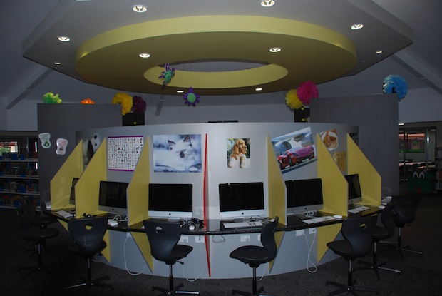 Library computer area with student workstations, desktop computers and learning resources in a modern learning space